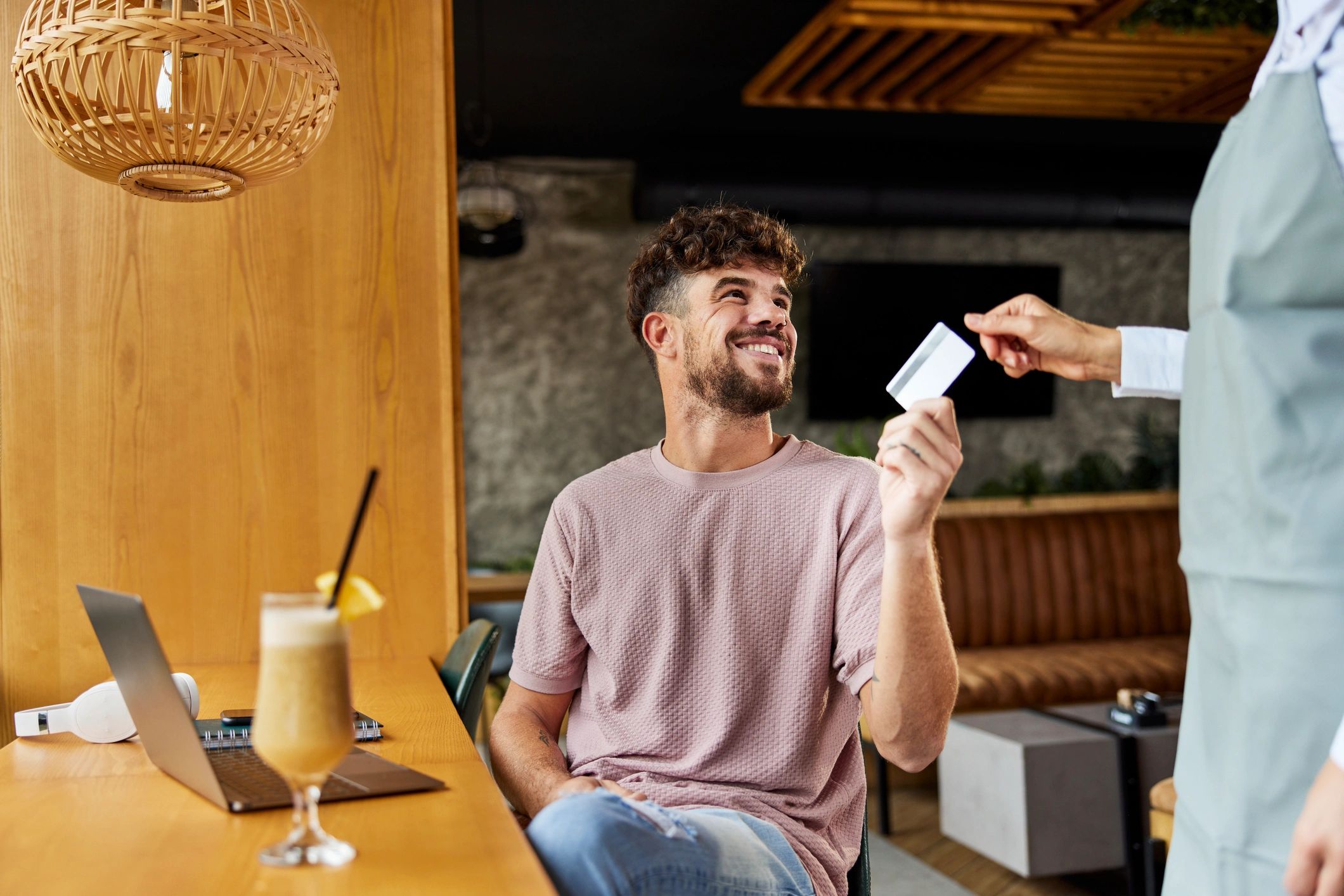 Guest paying by card at a hospitality counter