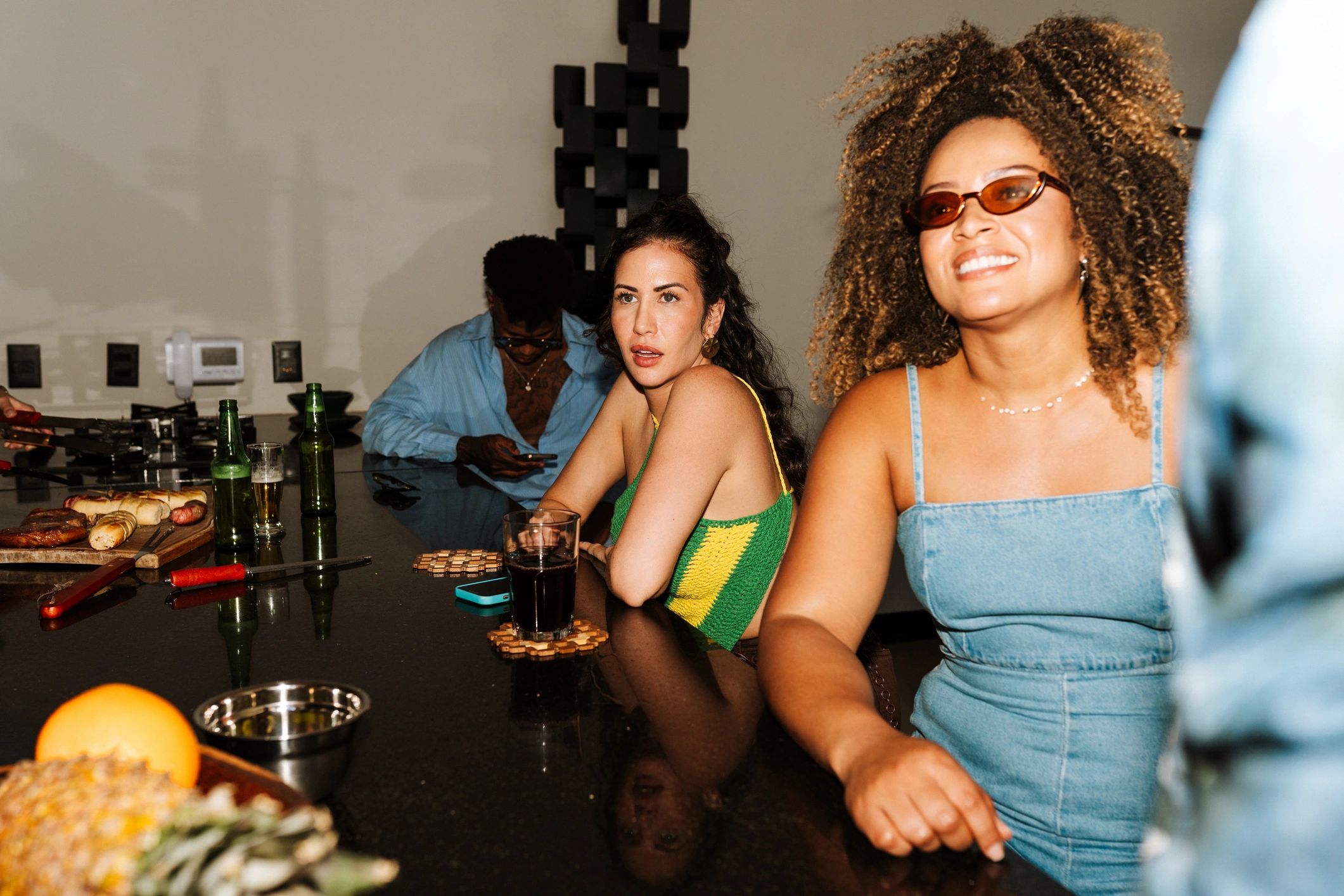 Guests socializing around a bar counter